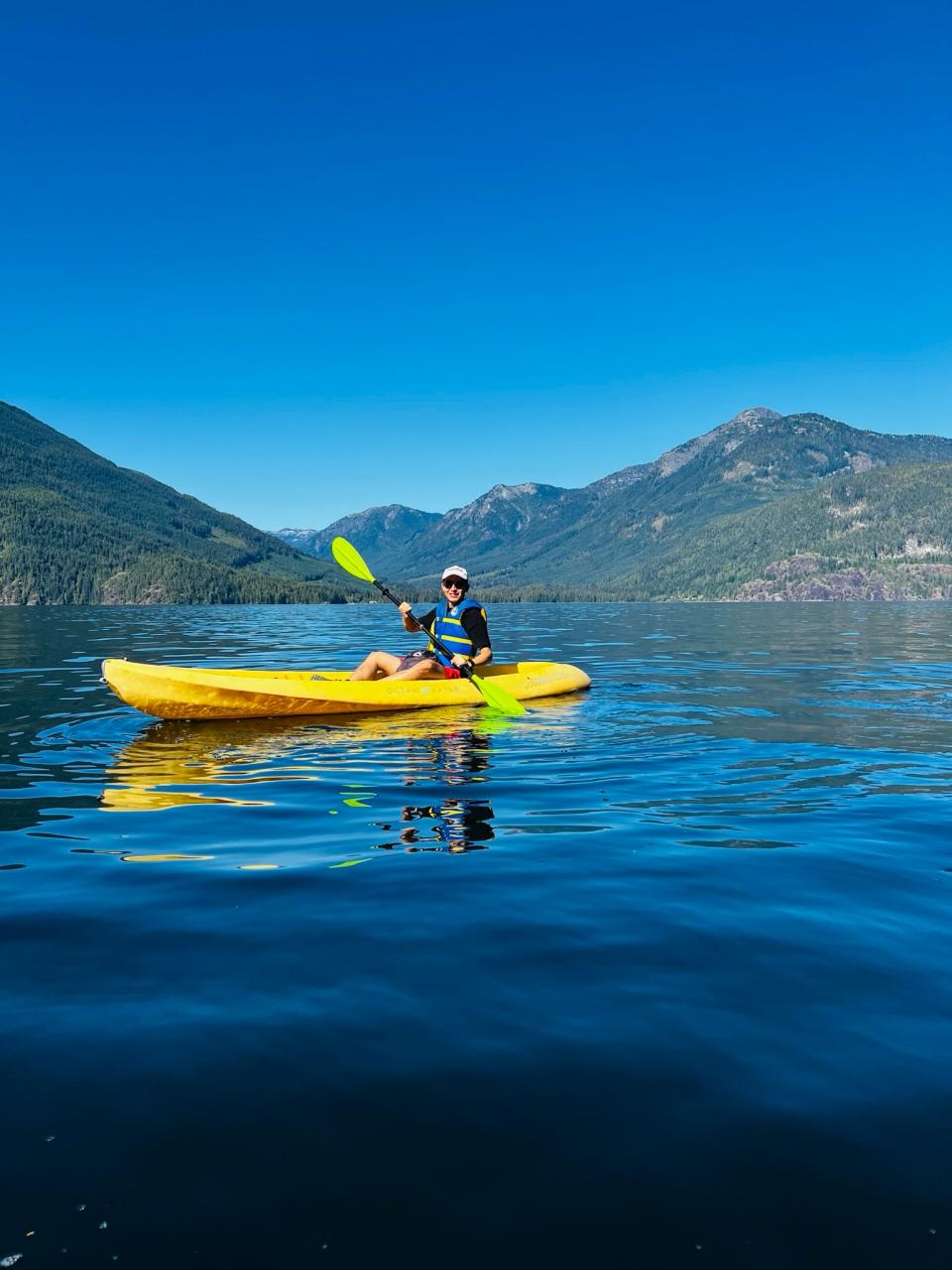 Nicolas kayaking at the CFES President's Meeting on Gambier Island